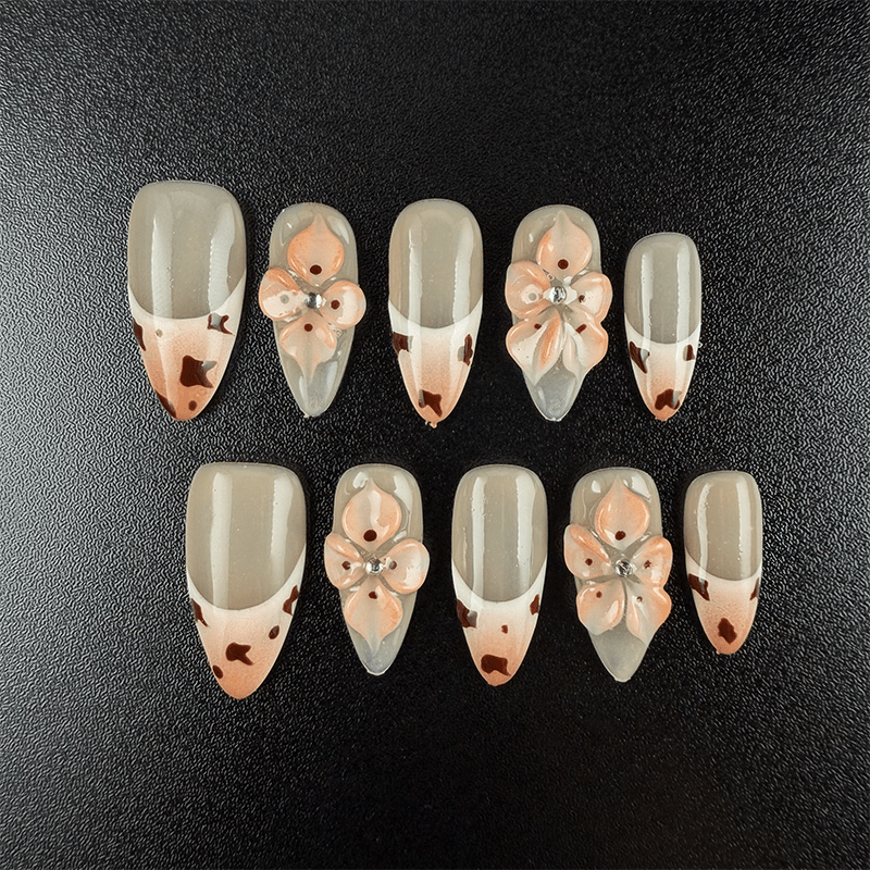 19 - Noah-UlightCow print almond press on nails with milk orange French tips and 3D flowers