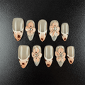 19 - Noah-UlightCow print almond press on nails with milk orange French tips and 3D flowers