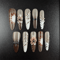 48 - Noah-UlightCoffee nude stiletto press on nails with zebra stripes and metallic charms
