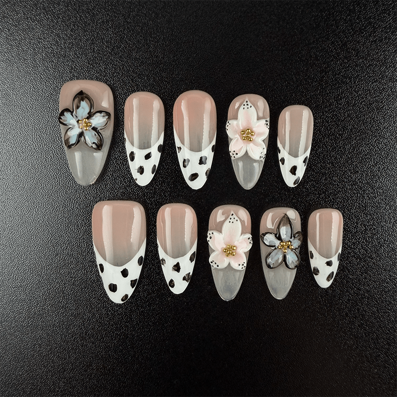 Almond cow print press-on nails with nude French tips