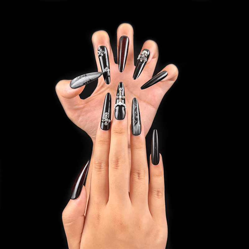 Long black burgundy goth stiletto press-on nails on hand