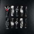 Black gothic press-on nails with silver glitter and red heart charm