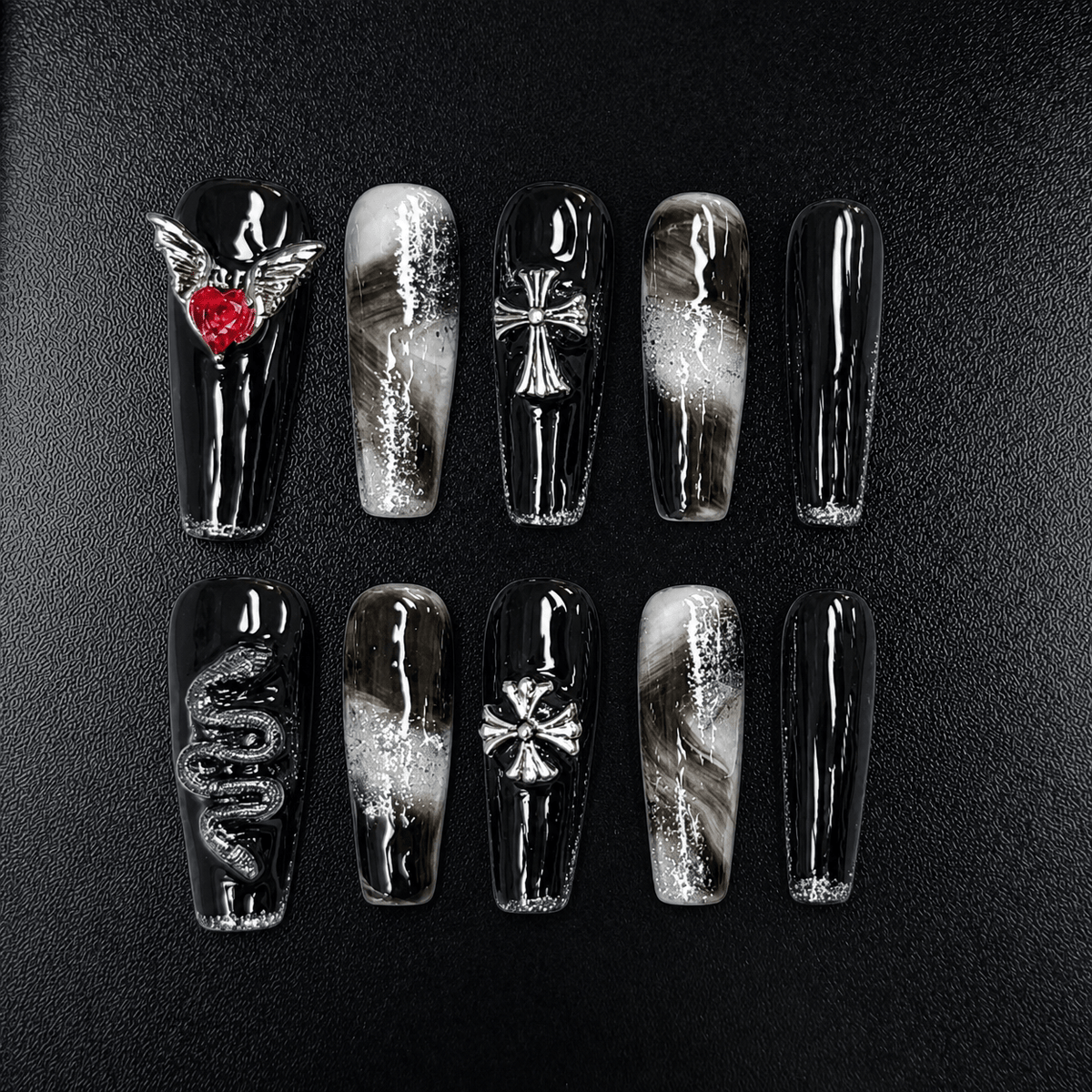 Black gothic press-on nails with silver glitter and red heart charm
