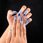Long coffin blue and white floral press-on nails on hand