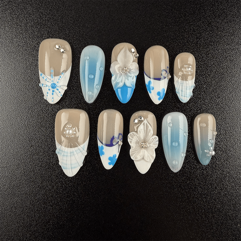 Blue floral almond press-on nails with white 3D flowers