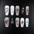 Gothic press-on nails in black, white, gray, and red
