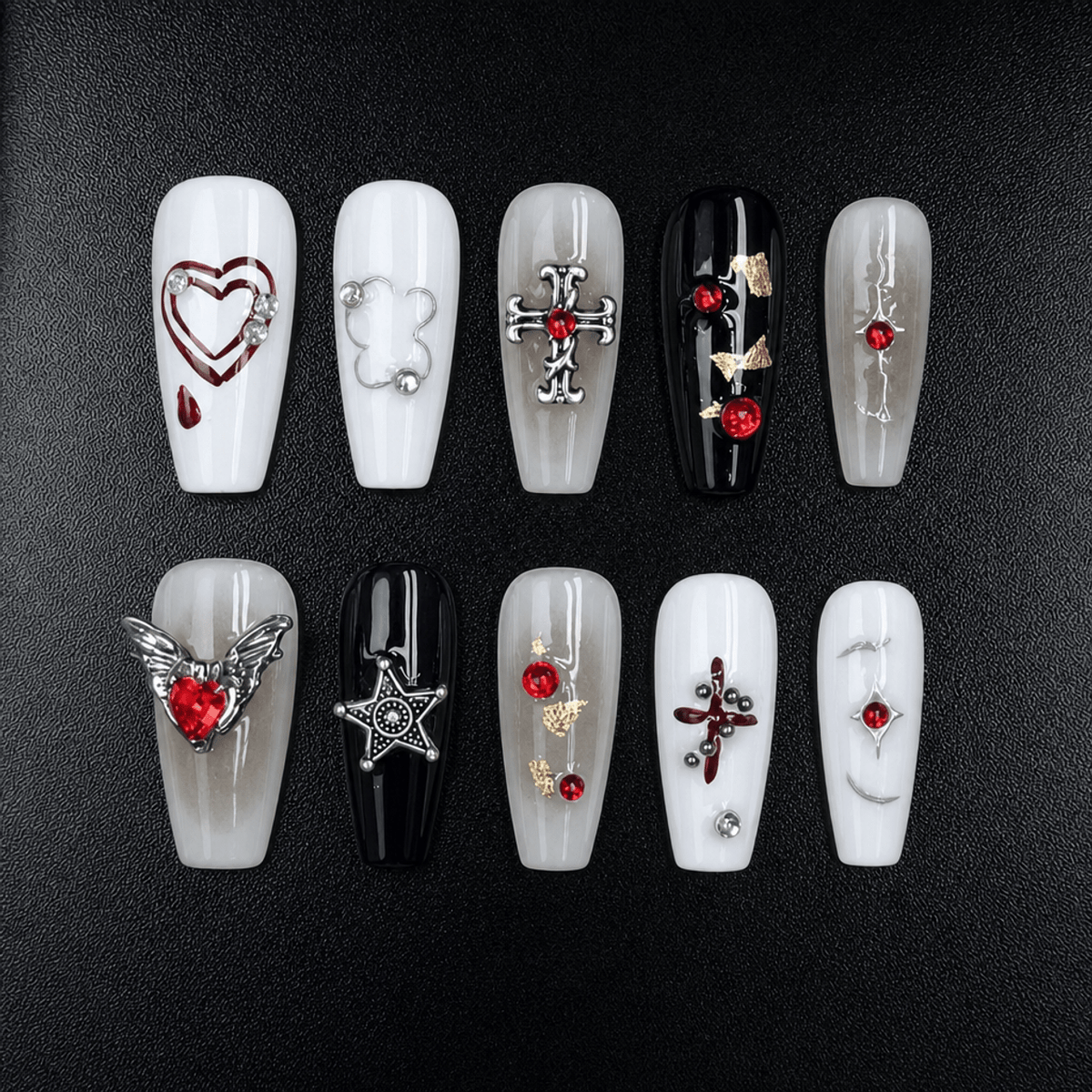 Gothic press-on nails in black, white, gray, and red