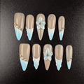 Long stiletto French tip press on nails with 3D blue flowers