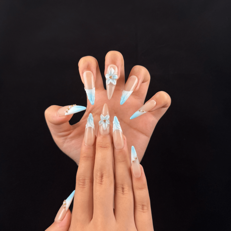 Long blue floral French tip press on nails with pearl details