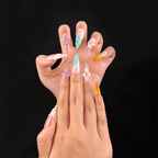Long almond mint green seashell press-on nails on hand
