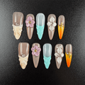 Mint green seashell press-on nails with floral details