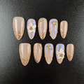 Nude aurora chrome press-on nails with gold lines and white flowers