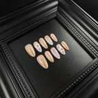 Long almond nude chrome press-on nails with 3D floral details