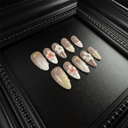 Long almond nude press-on nails with shell textures
