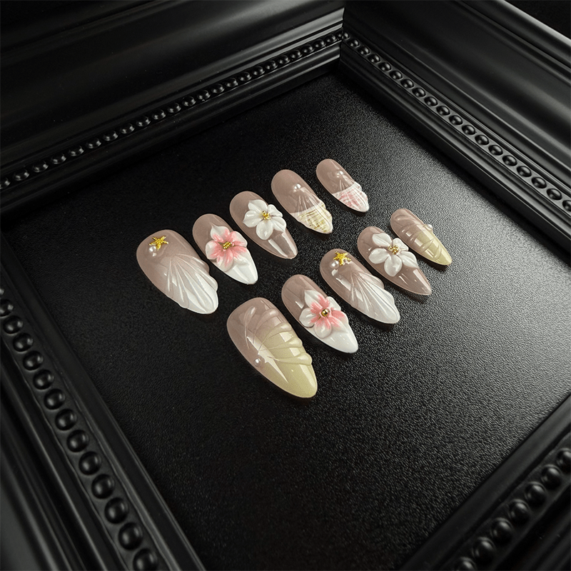 Long almond nude press-on nails with shell textures