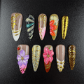 Nude stiletto press-on nails with 3D floral details