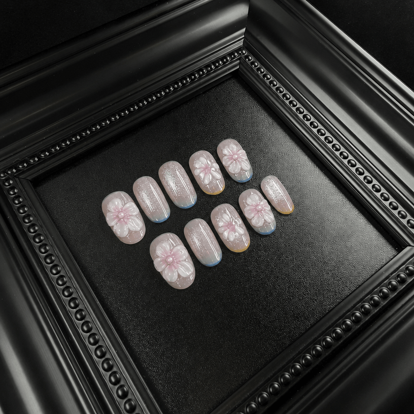 Glitter floral press-on nails with pink and gold accents